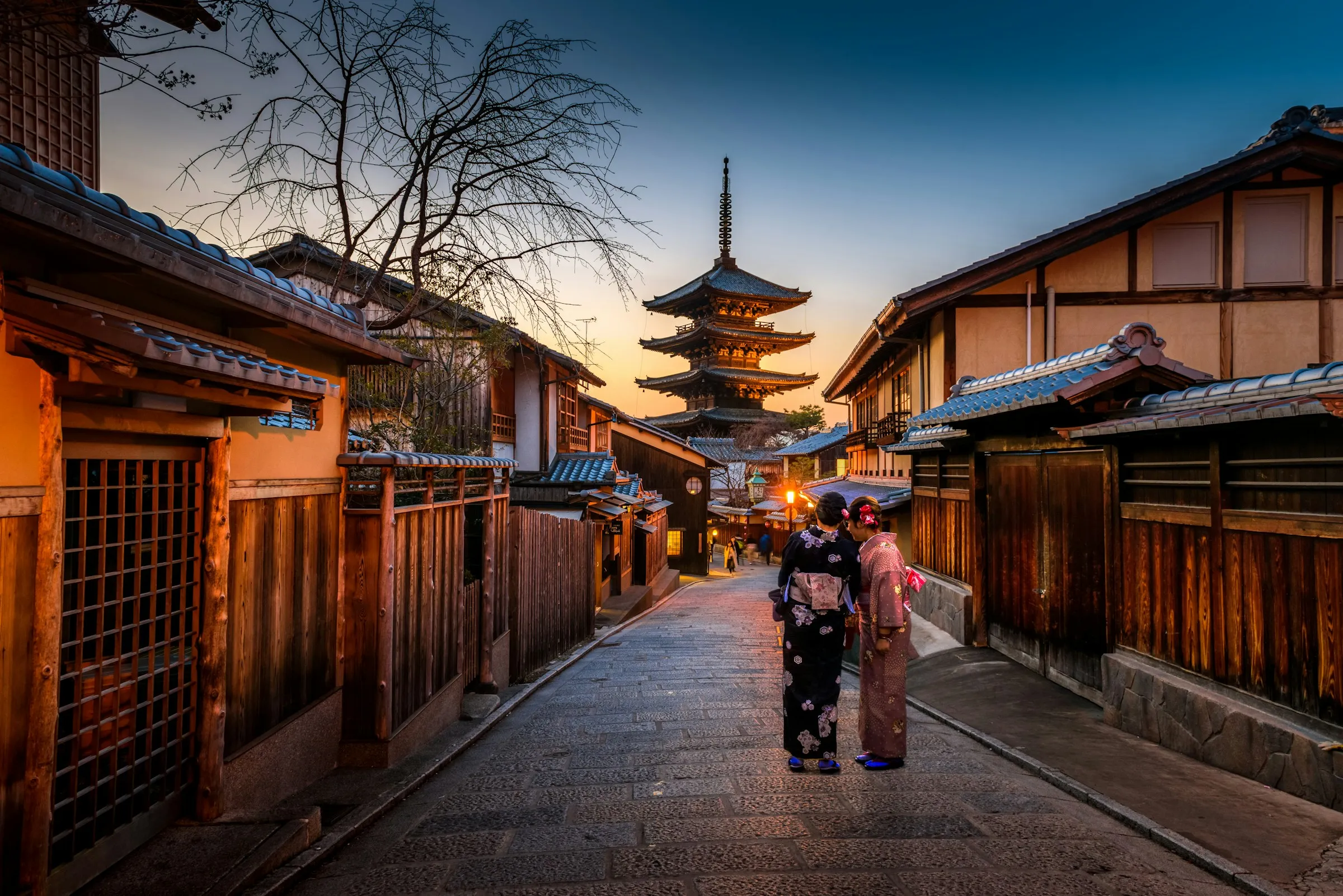 Image of Kimono-clad Visitors near a Kyoto Pagoda